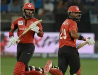  ?? AFP ?? Hong Kong openers Nizakat Khan (left) and captain Anshuman Rath put up a 174-run partnershi­p against India —