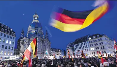  ?? JENS MEYER / THE ASSOCIATED PRESS ?? Protesters at a demonstrat­ion against the Islamizati­on of the West in Dresden, Germany, in 2015. Though the increasing backlash against globalizat­ion and trade worldwide has several causes, growing income inequality key among them, it is also tied to...