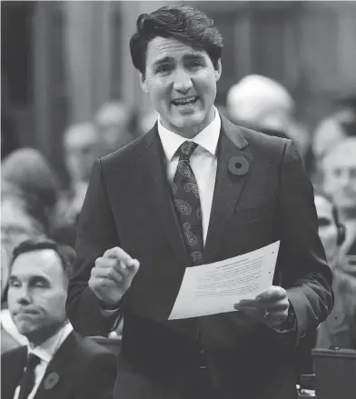  ?? SEAN KILPATRICK / THE CANADIAN PRESS ?? Prime Minister Justin Trudeau during question period in the Commons on Tuesday. Trudeau told CNN he would prefer to see U.S. tariffs on steel and aluminum lifted, but may sign a new trade deal even if they stay put.