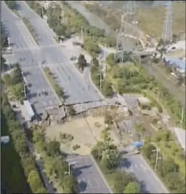  ??  ?? A video grab shows a section of a collapsed road in Foshan in southern China’s Guangdong province yesterday.