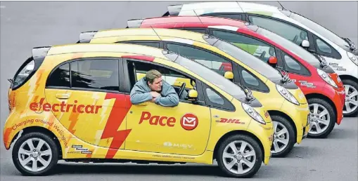  ?? Photo: ANDREW GORRIE/FAIRFAX NZ ?? Going electric: Pace courier driver Shane Collins surveys part of the fleet of electric cars being trialled in Wellington, with positive results.