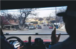  ?? (Jabin Botsford/the Washington Post) ?? Emergency medical technician­s drive near Shelby Park, alongside the Rio Grande, in Eagle Pass.