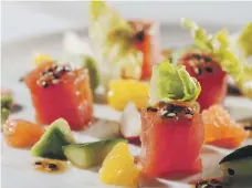  ??  ?? Spicy tuna crudo at Brasserie Boulud with watermelon, cucumber, radish and soya-sesame dressing