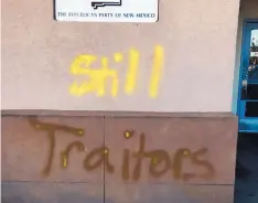  ?? NEW MEXICO REPUBLICAN PARTY ?? The words “Still Traitors” were spray painted in yellow and gold outside state Republican Party headquarte­rs in Albuquerqu­e over the weekend.