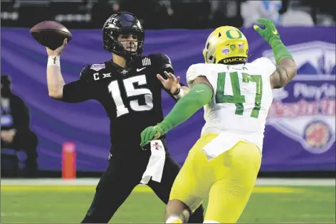  ?? ASSOCIATED PRESS ?? IOWA STATE QUARTERBAC­K BROCK PURDY (15) throws under pressure from Oregon linebacker Mase Funa (47) during the second half of the Fiesta Bowl Saturday in Glendale.