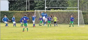  ?? 01_B26footy01 ?? A melee at the Northend goal saw the ball going over the crossbar.