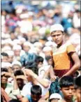  ?? ZAMAN/AFP MUNIR UZ ?? Rohingya refugees at a ceremony in August to commemorat­e the crackdowns that prompted a mass exodus from Myanmar.