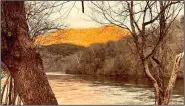  ?? (Arkansas Democrat-Gazette/Bryan Hendricks) ?? Skies cleared at sunset Jan. 16 to bathe the hills in soft golden sunlight at the confluence of the White and Buffalo rivers.