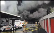  ??  ?? Dark smoke streams Saturday from the Storage at Summerlin facility at 7441 W. Lake Mead Blvd.