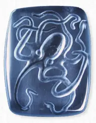  ?? NANCY ARTHUR- MCGEHEE ?? Nancy Arthur-McGehee is famous for her drawings, natural history scientific illustrati­ons, and handengrav­ed intaglio gems, like this octopus engraved on a 66-carat blue topaz, measuring 34.3 x 26.4mm.