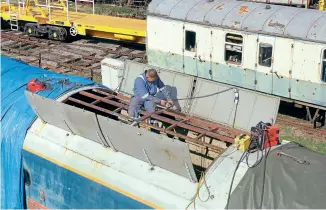  ??  ?? Contractor Ian Williams repairing the metal roof framework on 50030 Repulse at Rowsley South on Peak Rail.
The locomotive has undergone extensive metalwork repairs as owner RRRG works to return the Class 50 to service.
Mark Burrows/ RRRG