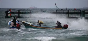  ?? (Reuters) ?? GAZANS ON a fishing boat near the port of Gaza City.