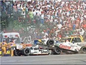  ?? ASSOCIATED PRESS ?? Alex Barron (right) crashes into Brian Herta on Turn 5 during the TexacoHavo­line 200 on Aug. 16, 1998, at Road America in Elkhart Lake. The drivers talked about the 20-year-old crash Friday ahead of the IndyCar Series race Sunday at the track.