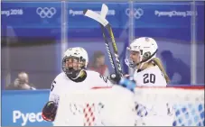  ?? Bruce Bennett / Getty Images ?? Kendall Coyne, left, of the United States celebrates with Hannah Brandt after scoring a goal in the second period against Finland on Sunday in Gangneung, South Korea.