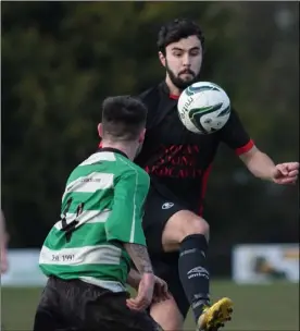  ??  ?? Daniel Murphy of Bridge Rovers controls the ball as John Kavanagh closes in.