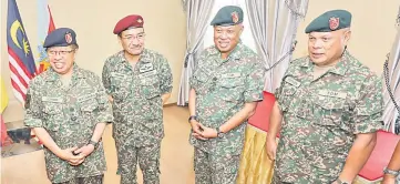  ??  ?? (From left) Abang Johari, Hishammudd­in, Affandi and Stephen pose for a group photo. — Photo by Chimon Upon