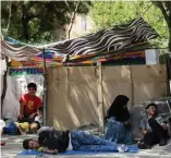  ?? — AFP ?? Afghan refugees at a makeshift camp in an Ankara park.