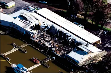  ?? KEN CANTRELL/VIEWPOINT AERIALS PHOTOGRAPH­Y/COURTESY PHOTOGRAPH ?? Several businesses in Tower Park Marina, including West Coast Canvas, were damaged by a fire Tuesday night.