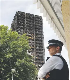  ?? AP PHOTO ?? British officials ordered an immediate examinatio­n Friday into a fridgefree­zer that is deemed to have started the fire in the 24-storey high-rise apartment building the early morning of June 14.