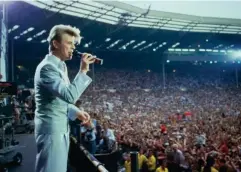  ?? (Getty) ?? Not in space, but still out of this world: David Bowie performs at Live Aid