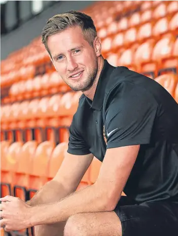  ??  ?? Above left: Billy King tries to escape the clutches of Dumbarton’s David Wilson; the winger relaxing at Tannadice. Below: Paul Dixon leads the celebratio­ns after the final whistle in last season’s play-off victory over Falkirk.