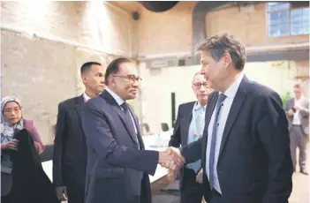  ?? — Bernama photo ?? Anwar shakes hands with Habeck during their meet before Anwar delivered his keynote address at the annual SME Future Day 2024.