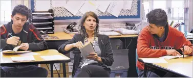  ?? NEW MEXICAN FILE PHOTO ?? Capital High School teacher Laura Carthy has a discussion with her class during a reading of Othello in 2016. Carthy says she has concerns about returning to the classroom. ‘I feel like they are trying to find a way to make people go back to school safely when it’s clearly not safe to go back to school,’ she says.