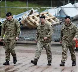  ??  ?? „
Military personnel outside Salisbury District Hospital yesterday.