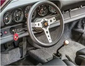  ??  ?? Below left and right: Interior features redesigned Cobra Stuttgart seats, with raised central bolsters that are trimmed in soft Muirhead leather. Momo steering wheel adds a classic touch