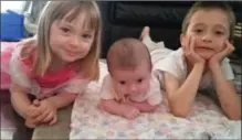  ?? BETH SKRT, THE CANADIAN PRESS ?? Jack Skrt, right, with his younger sisters Emily, 3, left, and Leah, three months old, in a July photo.