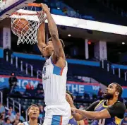  ?? [PHOTO BY NATE BILLINGS, THE OKLAHOMAN] ?? Dakari Johnson, shown here playing for the Oklahoma City Blue in March, had 20 points and eight rebounds Friday in the Thunder’s 88-87 Summer League-opening loss to the Charlotte Hornets.