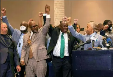  ?? Photo: VCG ?? Philonise Floyd ( 3rd from left), Attorney Ben Crump ( center) and Reverend Al Sharpton ( right) react following the verdict in the trial of former police officer Derek Chauvin in Minneapoli­s, Minnesota on Tuesday. Chauvin was convicted of murder and manslaught­er in the death of AfricanAme­rican George Floyd in a case that roiled the US for almost a year, reflecting deep racial divisions. ( See story on Pages 3, 17)
