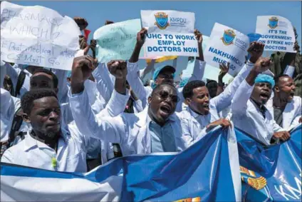  ?? Photo: Tony Karumba/afp ?? Health suffers: Intern doctors demonstrat­e outside the Kenyatta National Hospital in Nairobi to demand better terms including permanent employment.