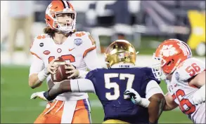  ?? Jared C. Tilton / TNS ?? Clemson quarterbac­k Trevor Lawrence looks to pass in the fourth quarter against Notre Dame during the ACC Championsh­ip game in Charlotte, N.C., on Dec. 19.