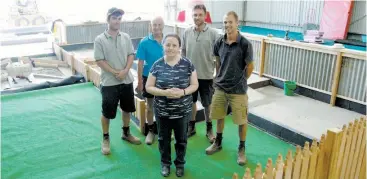  ??  ?? Making good progress on building the mini-golf course at the new Warragul Hub family community centre were, at rear from left, Brendan Brentwood, Bruce Harris, Tim Cannon and Ben Harris with the centre’s chairperso­n Julie Bellingham.