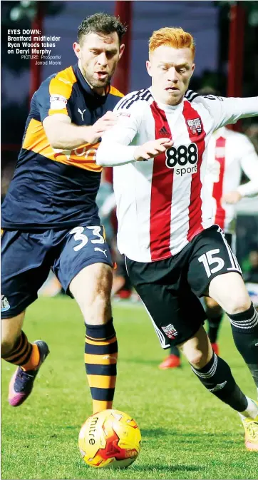  ?? PICTURE: ProSports/ Jarrod Moore ?? EYES DOWN: Brentford midfielder Ryan Woods takes on Daryl Murphy