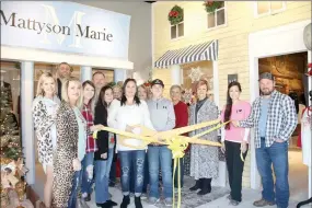  ?? PHOTOS BY LYNN KUTTER ENTERPRISE-LEADER ?? Prairie Grove Chamber of Commerce recently held a ribbon cutting for the new store, Mattyson Marie and Butch &amp; Koonz. The inside of the store is designed to look like a small town with different storefront­s. Two of the storefront­s can be seen in the background.