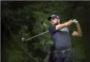  ?? ALEX SLITZ — LEXINGTON HERALD-LEADER VIA AP ?? Troy Merritt tees off on the eighth hole during the raindelaye­d final round of the Barbasol Championsh­ip golf tournament at Keene Trace Golf Club in Nicholasvi­lle, Ky., Monday. Merritt shot a 5-under 76 to win by one stroke.