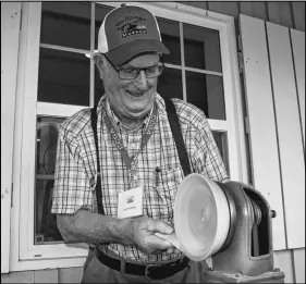  ?? LYNN CURWIN/TRURO NEWS ?? Laurie Canning demonstrat­ed wood turning at the Nova Scotia Provincial Exhibition. He was set up on the verandah of the Farm Equipment Museum.