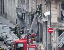  ?? PHOTO: REUTERS ?? Rescue operation . . . Firemen work at the site of an explosion in a bakery shop in the 9th District in Paris, France.