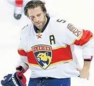  ?? SEAN KILPATRICK/AP ?? Panthers defenseman Aaron Ekblad leaves the ice with a cut on his face during the second period of Florida’s game with the Ottawa Senators on Saturday.