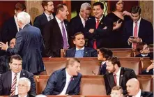  ?? Alex Brandon/Associated Press ?? Rep.-elect George Santos, R-N.Y. (center), shown in the House chamber last month, told donors he was a producer of the infamous Broadway flop “Spider-Man: Turn Off the Dark.”