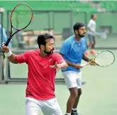  ?? SHASHIDHAR B. ?? Leander Paes and Rohan Bopanna at a training session in Bengaluru on Wednesday, ahead of their Davis Cup Group I tie against Uzbekistan beginning Friday.
—