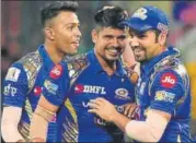  ?? AP ?? Skipper Rohit Sharma (right) congratula­tes Karn Sharma.