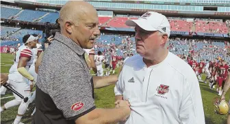  ?? HERALDFILE­pHoTo ?? MUTUAL ADMIRATION: Boston College coach Steve Addazio (left) shakes hands with UMass counterpar­t Mark Whipple following their teams’ 2016 game at Gillette Stadium. BC hosts UMass for its season opener Saturday at Alumni Stadium.