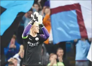  ?? ANTHONY DEVLIN/AFP ?? Goalkeeper Joe Hart applauds the crowd after Manchester City’s Champions League second-leg playoff against Steaua Bucharest on Wednesday night.