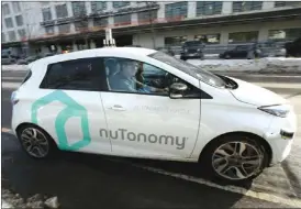  ?? The Associated Press ?? An autonomous vehicle is driven by an engineer through an industrial park in Boston earlier this month. Researcher­s at MIT are asking human drivers how they’d handle lifeor-death decisions in hopes of creating better algorithms to guide autonomous...