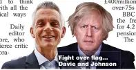  ??  ?? Fight over flag... Davie and Johnson