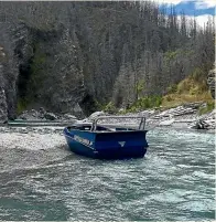  ??  ?? The Skippers Canyon Jet boat at the scene where it crashed into a canyon wall yesterday morning.