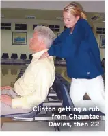  ??  ?? Clinton getting a rub from Chauntae Davies, then 22